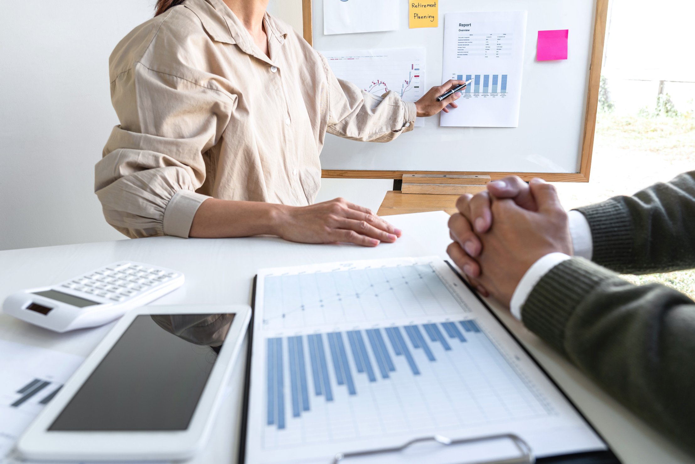 Business Casual Female Manager Presenting and Discussing Company Growth